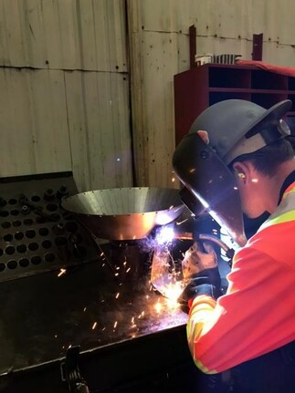 person welding